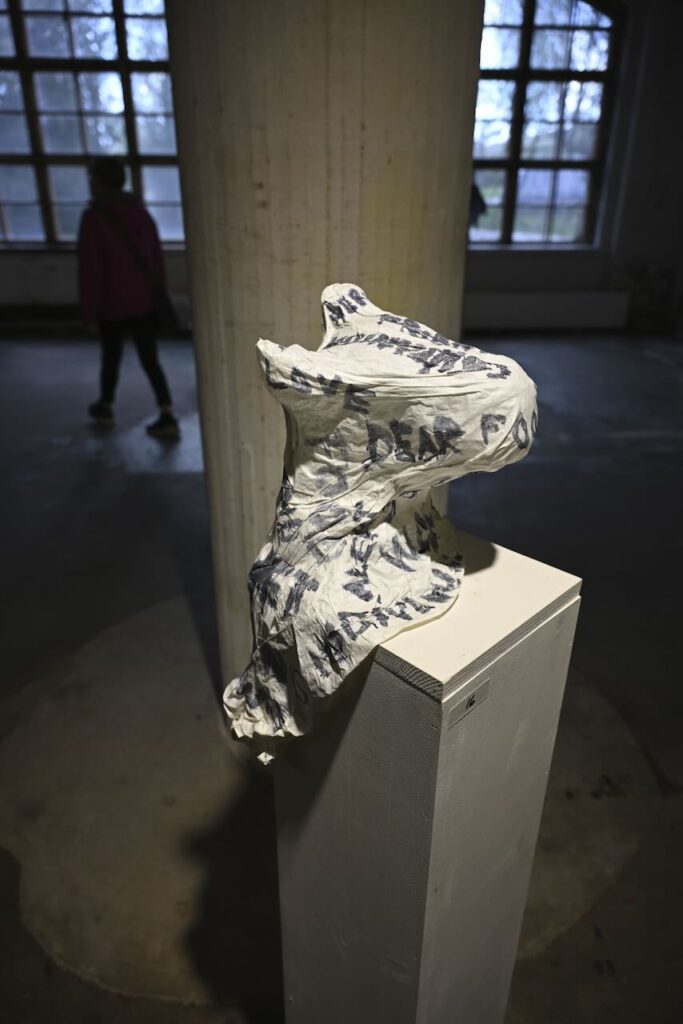 Shape of a sheep's head with text on it.